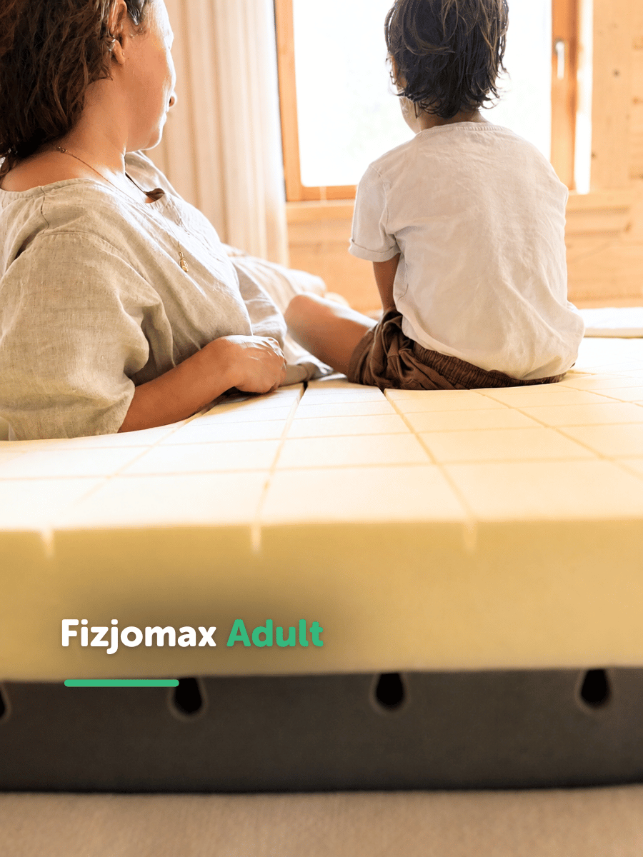 Dorosły i dziecko leżący obok siebie na materacu Fizjomax Adult